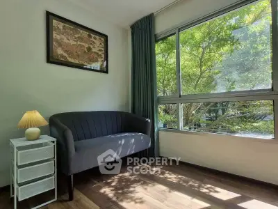 Cozy living room with large window and stylish decor