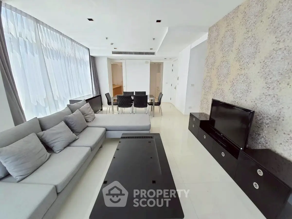 Spacious modern living room with elegant decor and ample natural light