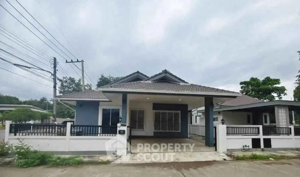 Charming single-story house with modern design and spacious driveway in a serene neighborhood.