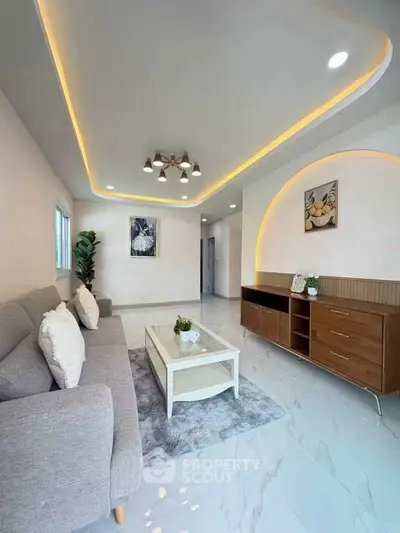 Modern living room with stylish ceiling lights and elegant decor