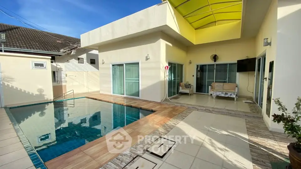 Luxurious modern home with private pool and spacious patio, perfect for relaxation and entertaining.