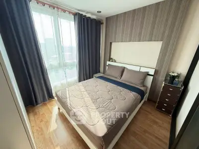 Modern bedroom with large window and stylish decor