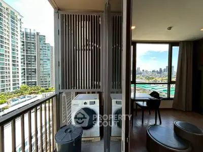 Modern apartment with balcony featuring washer and dryer, offering stunning city views.