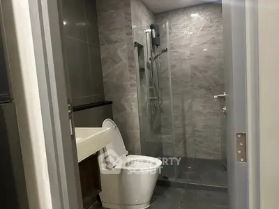Modern bathroom with sleek design and glass shower enclosure