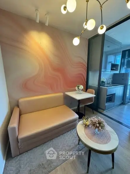 Stylish living room with modern decor and open kitchen layout