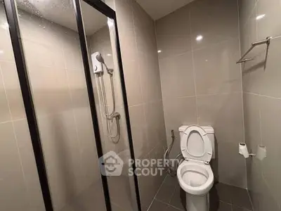 Modern bathroom with glass shower and sleek tile design