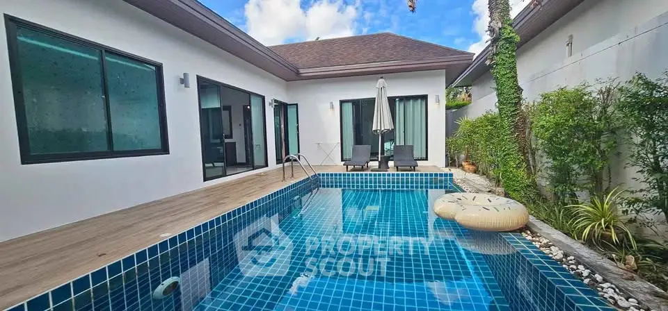 Stunning modern villa with private pool and lush greenery, perfect for luxury living.