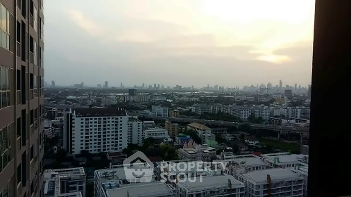 Stunning cityscape view from high-rise building at sunset, showcasing urban skyline and vibrant city life.