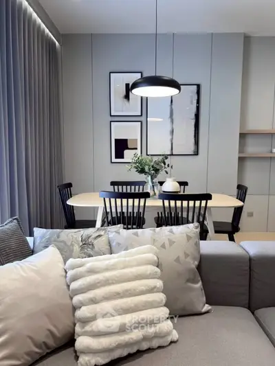 Modern living room with elegant dining area and stylish decor