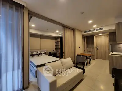 Modern studio apartment with open layout, featuring a cozy living area, dining space, and stylish bedroom.
