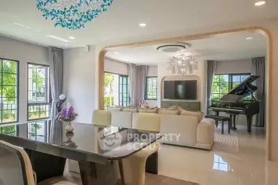 Luxurious open-plan living room with grand piano and elegant dining area