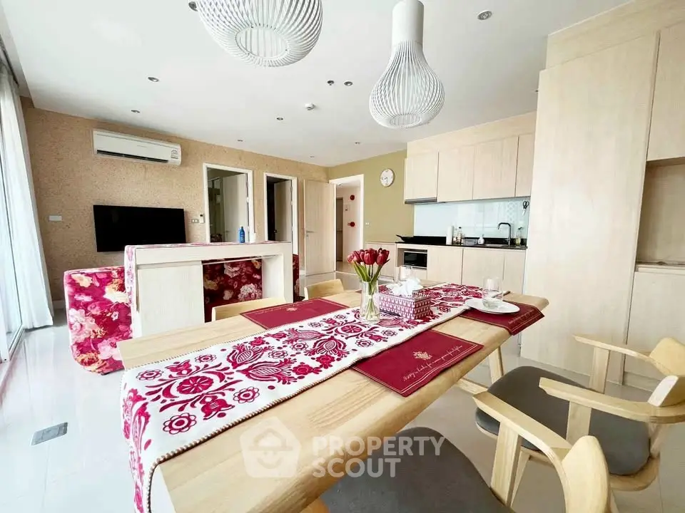 Chic open-plan living room with modern kitchen and stylish dining area