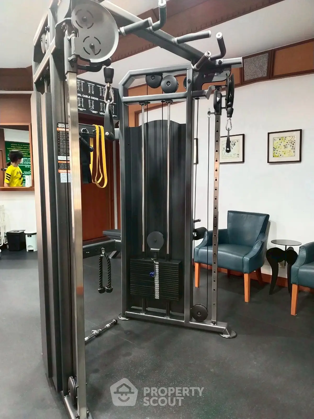 Modern gym with state-of-the-art fitness equipment and comfortable seating area.