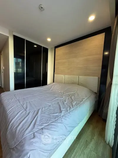 Cozy bedroom with modern design and ample natural light