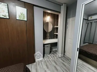 Modern bedroom with stylish decor and mirrored wardrobe