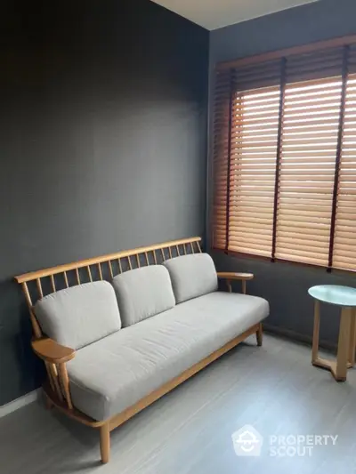 Cozy minimalist living room with wooden sofa and blinds