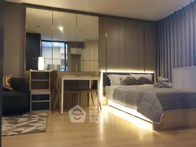 Modern bedroom with stylish decor and cozy lighting in a contemporary apartment.