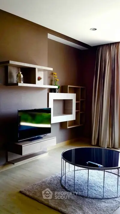 Modern living room with stylish shelving and flat-screen TV