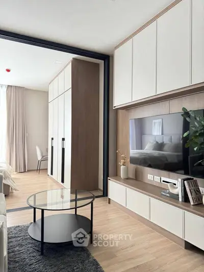 Modern living room with sleek furniture and built-in storage, perfect for stylish urban living.