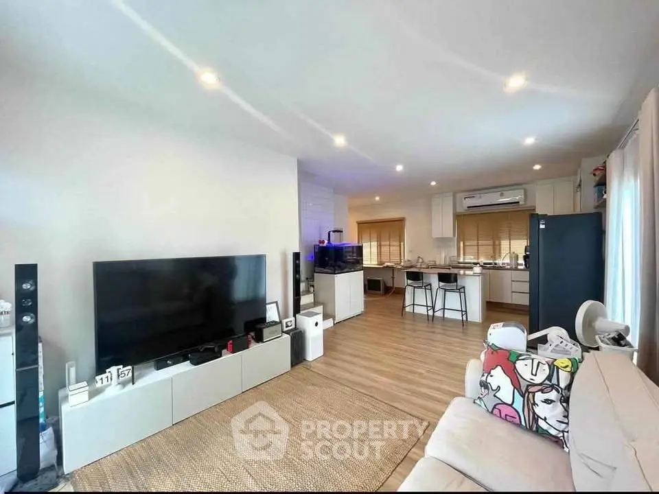 Spacious modern living room with open kitchen and stylish decor