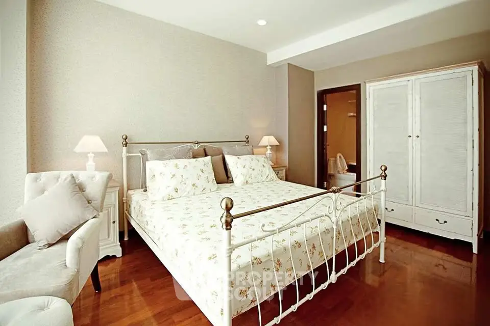 Elegant bedroom with classic metal bed frame and cozy decor