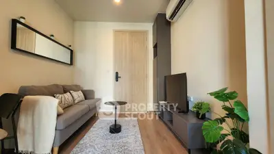 Modern living room with cozy sofa, stylish decor, and air conditioning in a contemporary apartment.