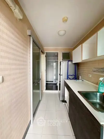 Modern kitchen with sleek cabinetry and stainless steel appliances