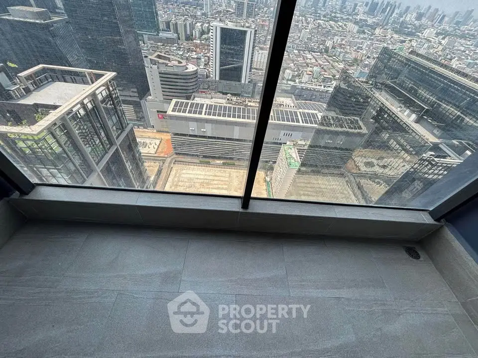 Stunning high-rise city view from a modern balcony, perfect for urban living enthusiasts.