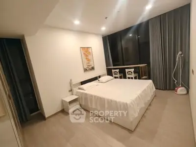 Modern bedroom with large window and minimalist decor