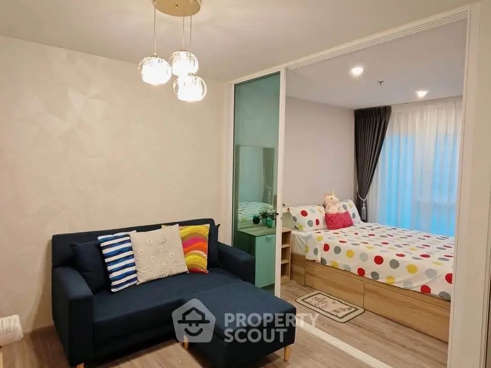Charming modern living room with cozy sofa and stylish bedroom view, perfect for urban living.