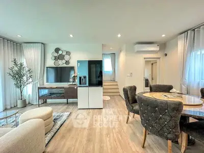 Spacious modern living room with elegant dining area and stylish decor
