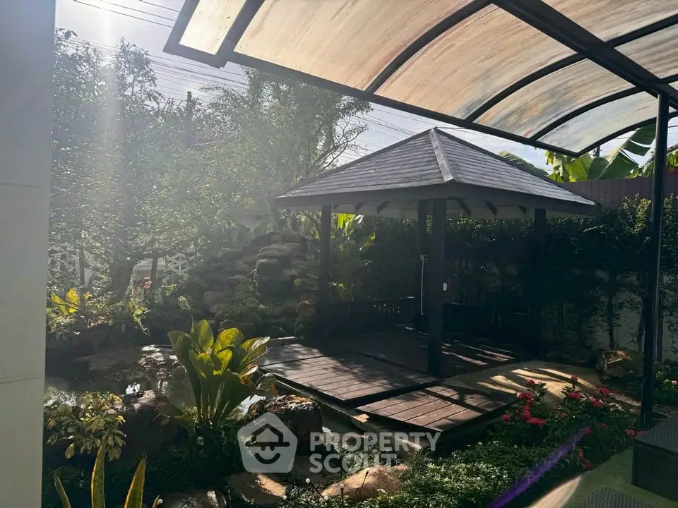 Charming garden with gazebo and lush greenery, perfect for relaxation and outdoor gatherings.