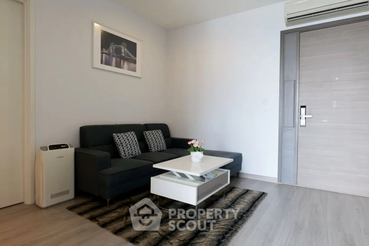 Modern living room with sleek furniture and stylish decor in a contemporary apartment.