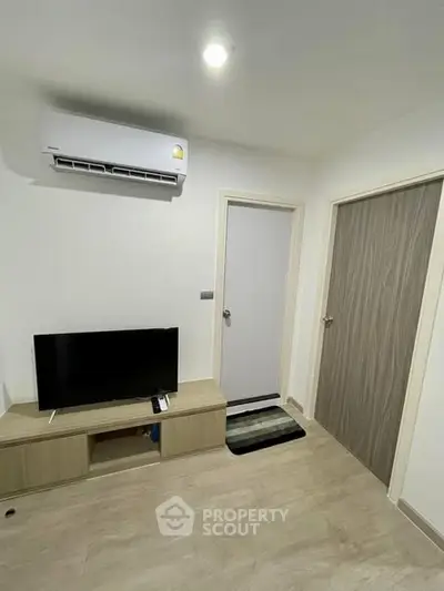 Modern living room with air conditioning and sleek wooden furniture