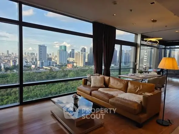 Luxurious living room with stunning city skyline view and elegant furnishings.