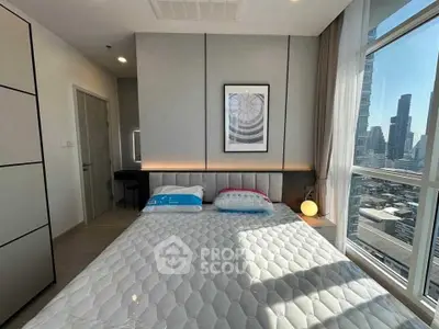 Modern bedroom with city view and stylish decor