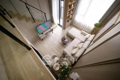 Modern loft-style living room with high ceilings and elegant decor