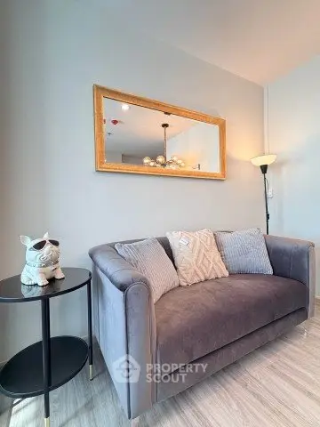 Stylish living room with plush gray sofa and elegant decor