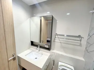 Modern bathroom with sleek sink and mirror design