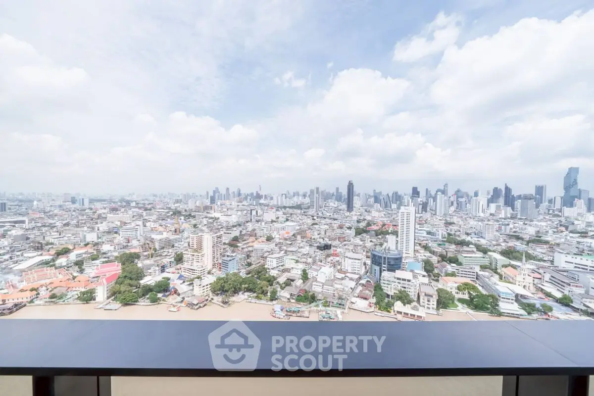 Stunning panoramic cityscape view from high-rise balcony, perfect for urban living.