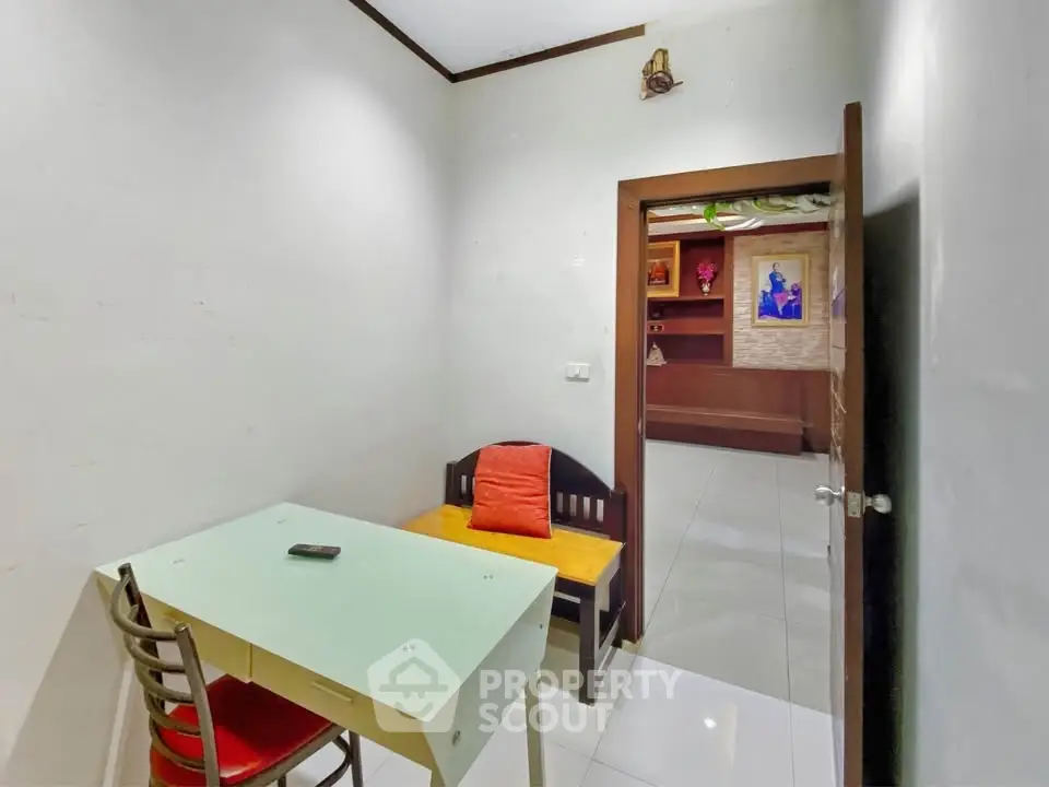 Cozy study room with modern desk and seating, ideal for productivity.