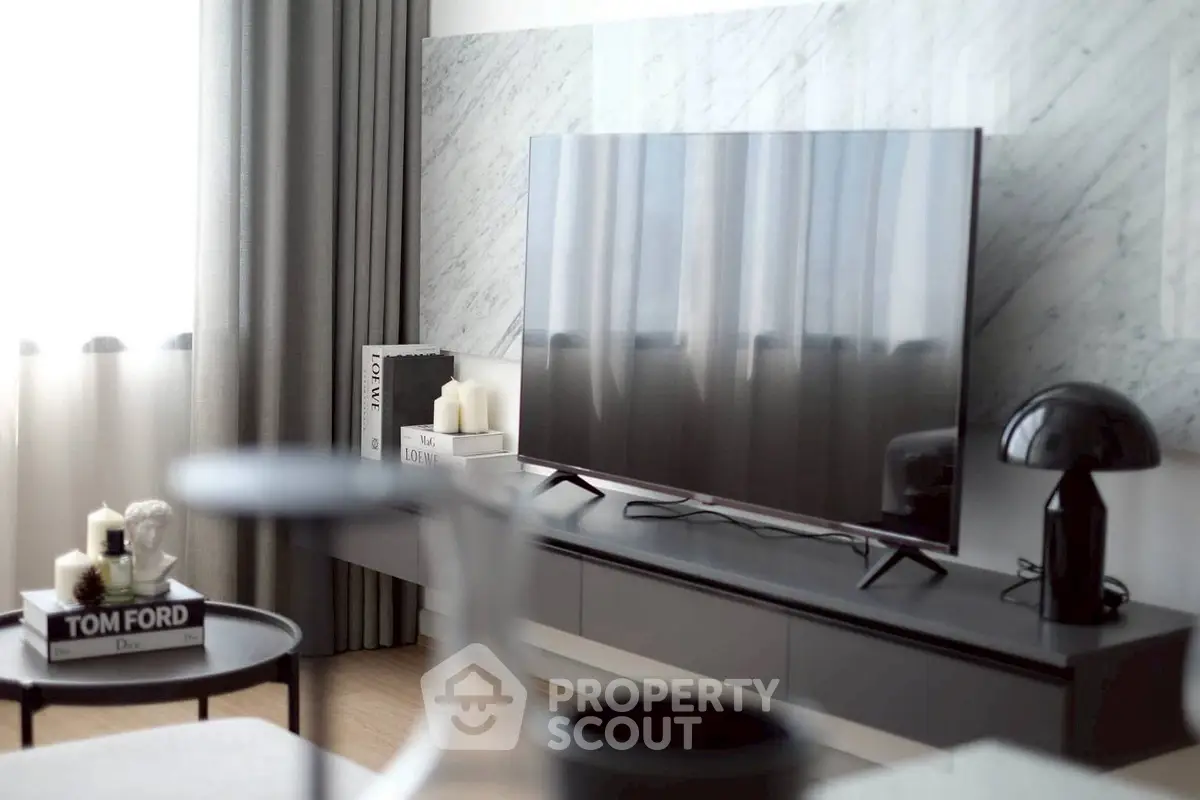Modern living room with sleek TV and stylish decor