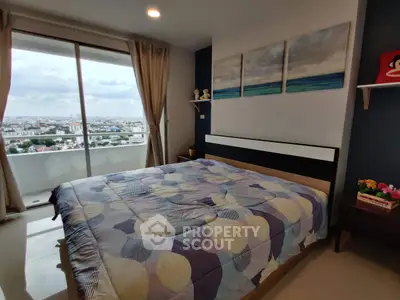Spacious bedroom with stunning city view and modern decor