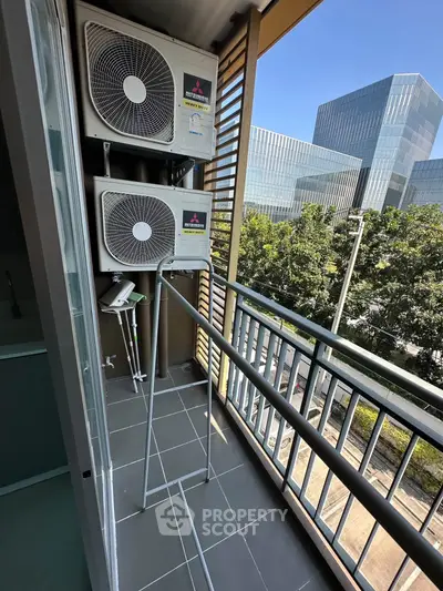 Modern balcony with air conditioning units and city view, perfect for urban living.