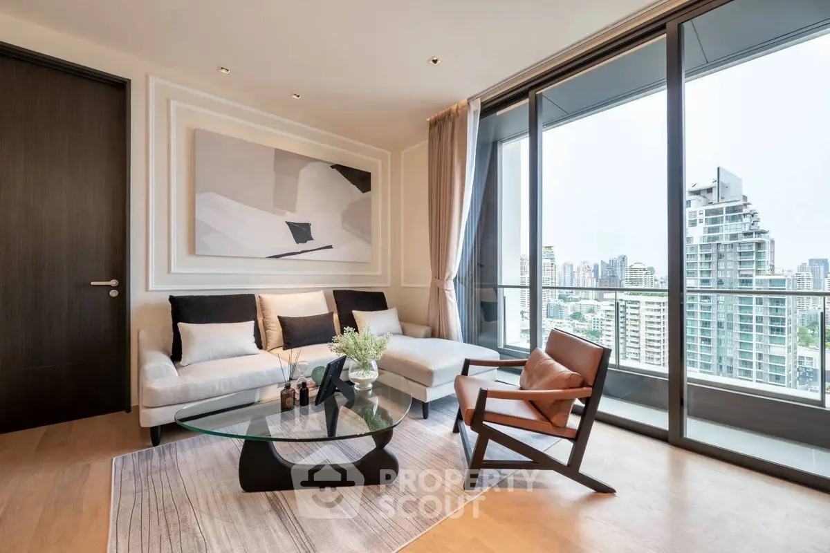 Modern living room with large windows and city view, featuring stylish furniture and elegant decor.