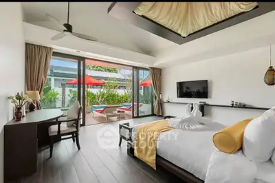 Luxurious bedroom with pool view and elegant decor in modern villa