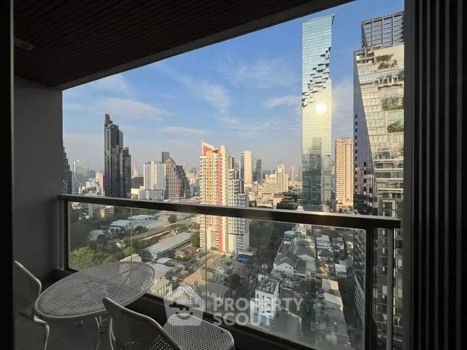 Stunning cityscape view from a modern balcony with sleek furniture, perfect for urban living.