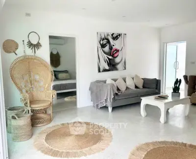 Stylish living room with modern decor and cozy seating area, featuring unique artwork and natural textures.