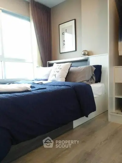 Cozy modern bedroom with stylish decor and natural light