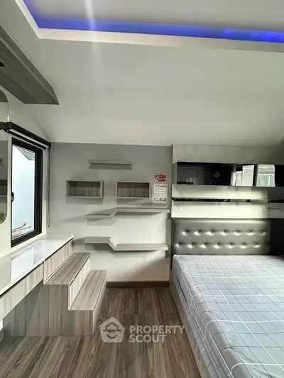 Modern bedroom with stylish shelving and ambient lighting